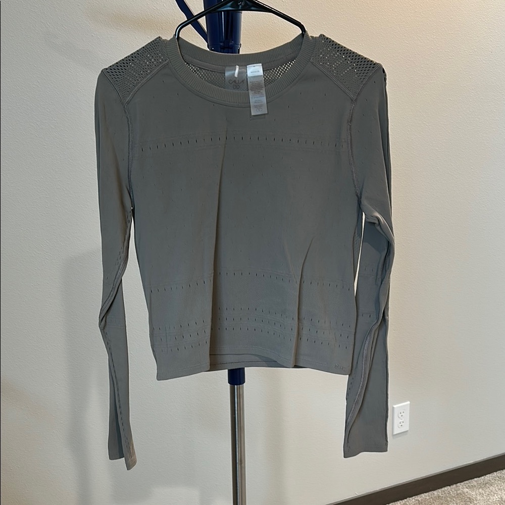 Calia brown top with some
hem damage. See photo